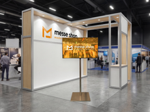 messe.shop 55" Full HD screen on a silver stand, ideal for trade shows and events.